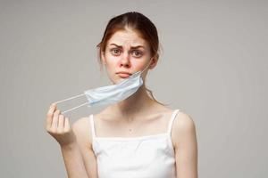 red-haired woman in white t-shirt with a scarf light background photo