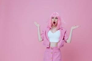 Beautiful fashionable girl gesturing with hands pink jacket lifestyle glamor color background unaltered photo