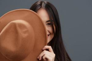 beautiful woman in a stylish suit beige hat posing studio model photo