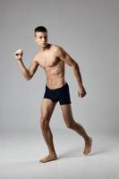 guy in shorts running indoor sport fitness athletics photo