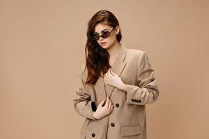 woman with glasses Glamor beige coat portrait Copy Space photo