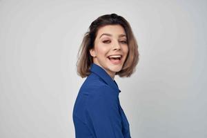 Business woman in blue shirt wearing glasses fashion studio photo