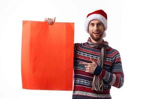 emotional man Red paper billboard advertising christmas light background photo