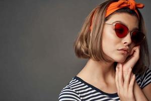 woman with headband sunglasses posing fashion cropped view photo