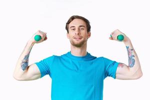 sporty man with pumped up arms tattoo exercise cropped view fitness photo