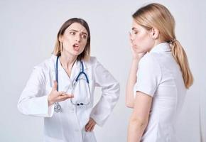 The patient complains to the doctor at will and a blue stethoscope photo