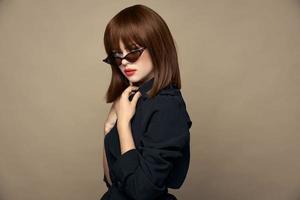 Sexy woman tilted her head makeup dark glasses photo
