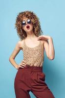 woman curly hair Red lips open mouth fashionable clothes photo