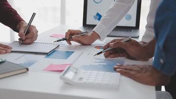 Financial analysts analyze business financial reports on a digital tablet planning investment project during a discussion at a meeting of corporate showing the results of their successful teamwork. video