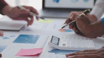 Financial analysts analyze business financial reports on a digital tablet planning investment project during a discussion at a meeting of corporate showing the results of their successful teamwork. video