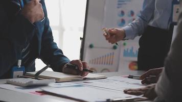 Financial analysts analyze business financial reports on a digital tablet planning investment project during a discussion at a meeting of corporate showing the results of their successful teamwork. video