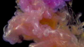 Color drop underwater creating a silk drapery. Ink swirling underwater. Reverse shooting video