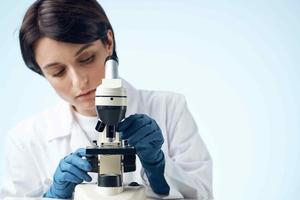 woman laboratory assistant microscope science technology professional research photo