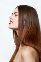 Brunette with bare shoulders side view charming look photo