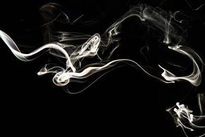 Smoke effect texture. Isolated background. Black and dark backdrop. Smokey fire and mistic effect. photo