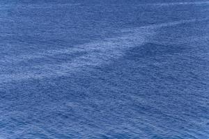 blue abstract surface of sea waves photo