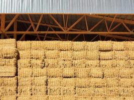 hay barn full of stacks of hay bales photo