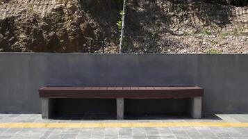 Concrete semen and wood outdoor bench park. photo