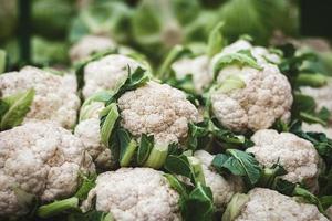 cauliflower and cabbage sale at organic vegetable market photo