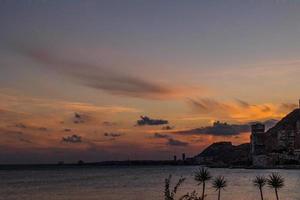 picturesque sunset on the beach in the Spanish city of Alicante photo