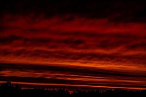 landscape with red sky clouds after sunset photo