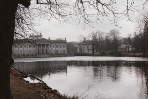 water palace in the roya park in poland on the pond on an autumn day photo