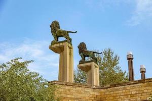 vintage lions on a stone bridge in Zaragoza Spain against the sky photo