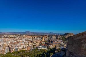 view on a sunny day of the city and colorful buildings from the viewpoint Alicante Spain photo