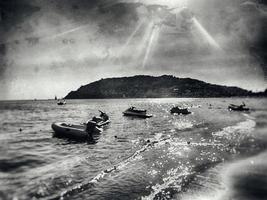 photo of a beach in Turkey in Alanya on a beautiful summer day stylized as an old photographA beautiful photo of a beach in Turkey in Alanya on a beautiful summer day stylized as an old photograph