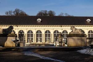 landscape with historic building in early spring sunny day in city park Warsaw Poland photo