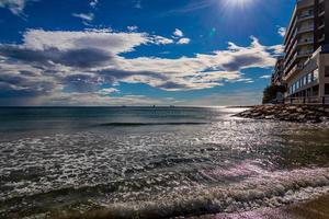 urban landscape of Alicante Spain building on the seafront by the beach photo