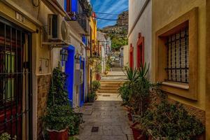 l historic old colorful houses Barrio Santa Cruz Alicante Spain on a sunny day photo