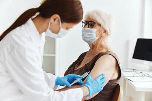 patient and doctor syringe injection vaccine passport virus epidemic photo