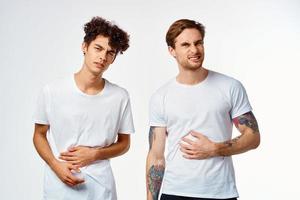 emotional two friends in white t-shirts yes fun studio photo