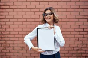 cheerful business woman folder manager photo