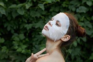 Beautiful woman bare shoulders face mask rejuvenation photo