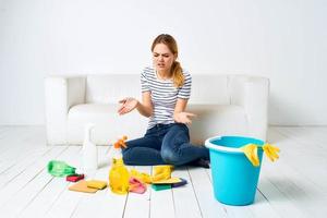 Woman at home near couch rendering services at home interior photo