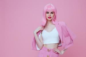 Portrait of a charming lady gesturing with hands pink jacket lifestyle glamor Studio Model unaltered photo