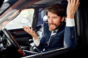 bearded man Driving a car trip luxury lifestyle success photo