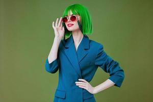 pretty woman green hair blue jacket sunglasses photo