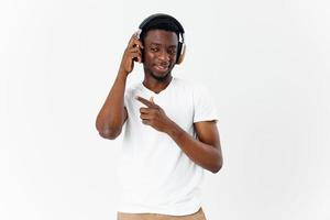 Cheerful man in wireless headphones music lover entertainment isolated background photo