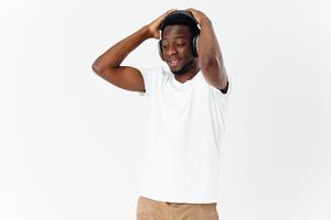 Cheerful man in headphones holding his head joy studio music lover photo