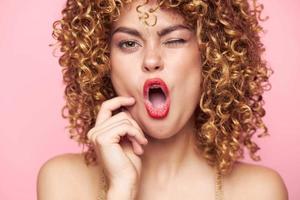 Woman portrait Curly hair red lips close-up sequin shirt photo