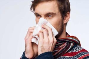 emotional man with a handkerchief health problem flu symptoms isolated background photo