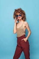 woman sunglasses fashionable lifestyle attractive look red pants photo