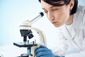 woman with microscope laboratory microbiology technology science photo