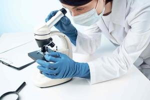 female laboratory assistant microscope research biotechnology nothing photo