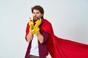 Man in red raincoat rubber gloves cleaning professional homework photo