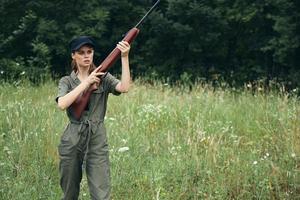 Woman Weapons outdoors fresh air hunting black cap photo