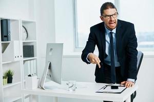 office worker in the office gestures with his hands executive photo